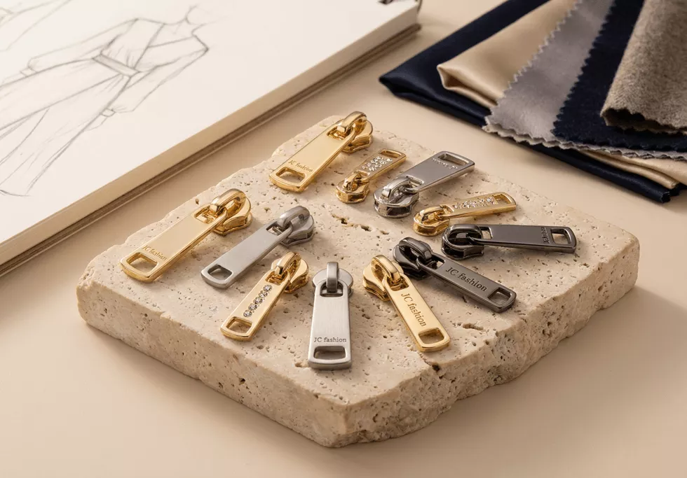 JC Fashion Zipper help small fashion brands create custom zipper pulls. Low MOQ from 100 pieces, fast sampling in 3-7 days, and no die fee for simple logos. Stock zippers cut by the meter with no minimum.